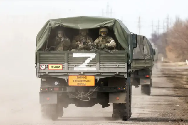 A column of army trucks approaches the Perekop checkpoint on the Ukrainian border