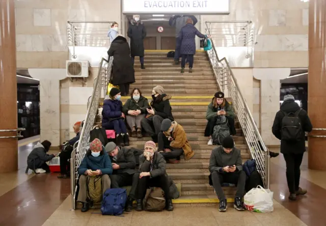 People take shelter in a subway station in Kyiv on 24 February 2022