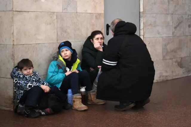 People shelter in a Kyiv metro station