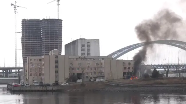 Smoke rises as a fire burns on the premises of the Ukrainian Defence Ministrys unit in Kyiv