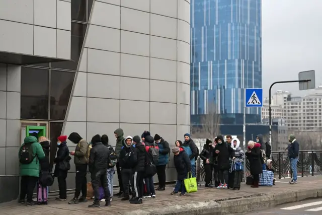 Queue outside cashpoint in Kyiv on 24 February 2022