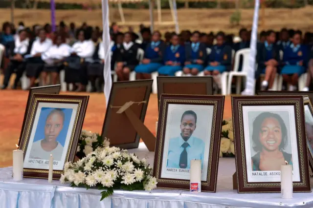 People attend the requiem mass for 10 young girls who died in the Moi Girls School dormitory fire, in Nairobi on September 14, 2017