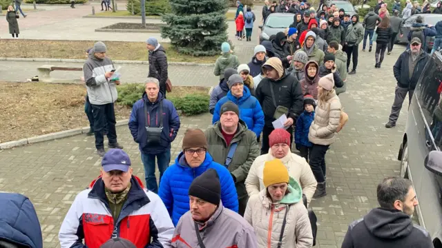 Ukrainians in Dnipro queue to volunteer to fight