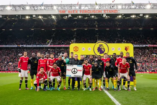 Manchester United and Watford players hold up peace banner