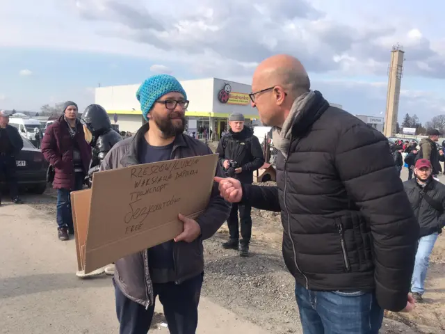 man with cardboard sign