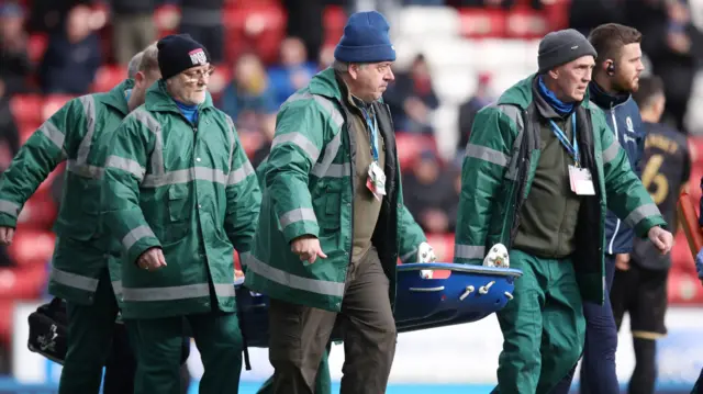 Ryan Nyambe stretchered off