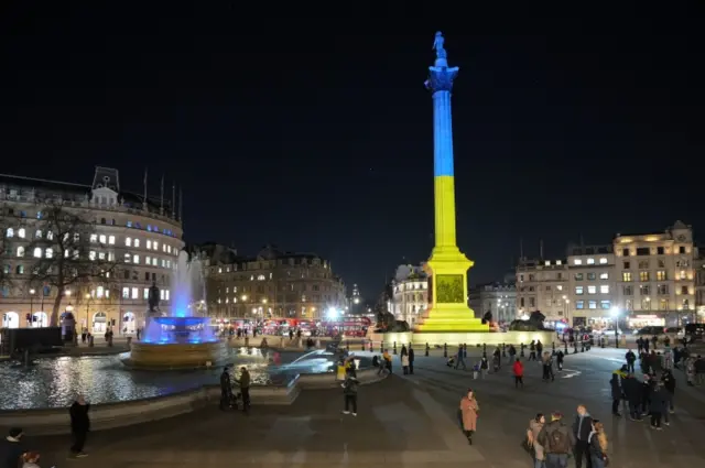 Nelson's Column in Trafalgar Square, London, is lit up in yellow and blue in an expression of solidarity with Ukraine following Russia"s invasion.