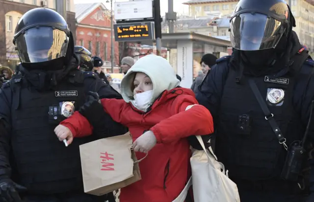 Protester detained by police