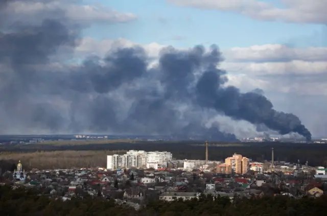 Smoke rises in Kyiv amid an invasion by Russia