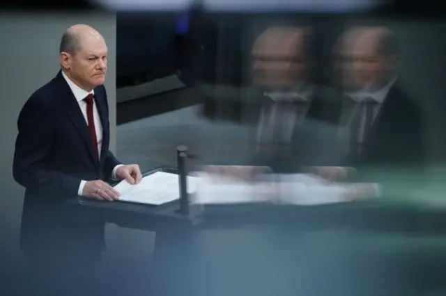 German Chancellor addressing parliament