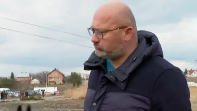 A Ukrainian man at the border with Poland