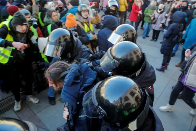 Protester being detained