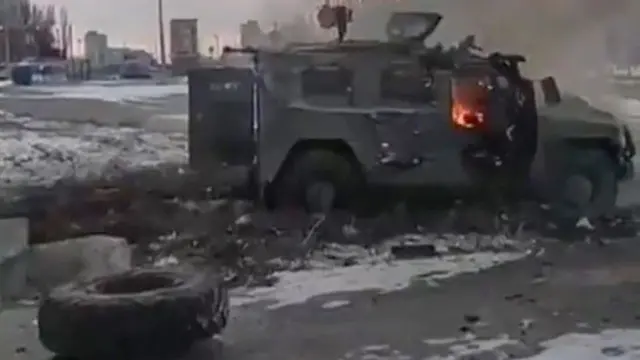 A screen grab captured from a video shows a Russian armored vehicle burning after it was destroyed by Ukrainian forces in Kharkiv, Ukraine February 27, 2022