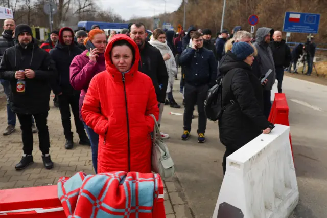 People waiting at the Ukrainian-Polish border