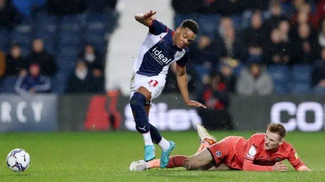 Grady Diangana of West Bromwich Albion is tackled by Flynn Downs of Swansea City