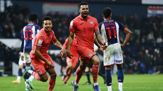 Cyrus Christie celebrates scoring his goal