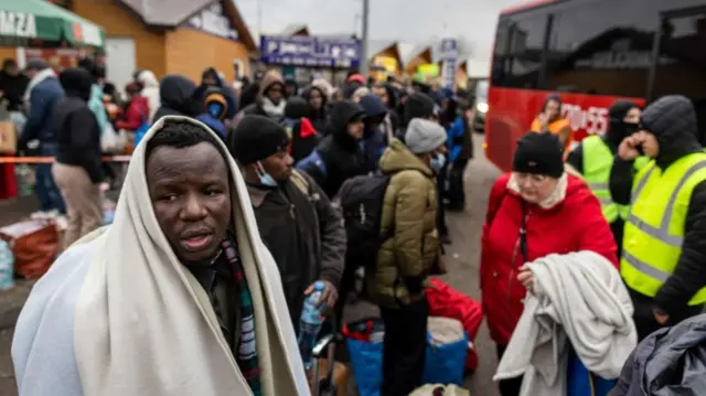 African nationals, mostly students of Ukrainian universities, at the Medyka pedestrian border crossing.