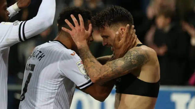 Jamie Paterson celebrates with Korey Smith