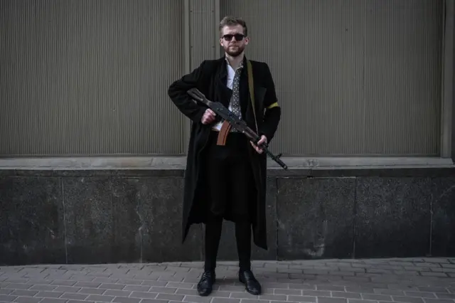 A Ukrainian man with a gun on the street