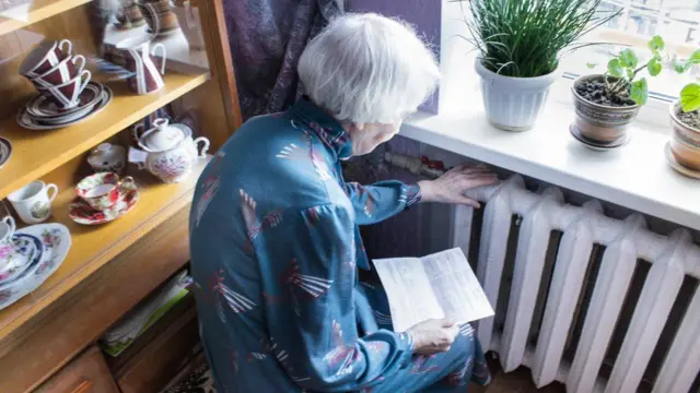 Pensioner feeling radiator