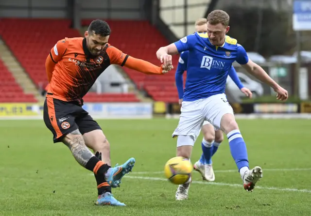 Tony Watt is closed down by Jason Brown as he tries to bend a cross in.