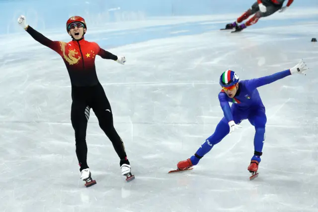 China celebrate as they cross the line