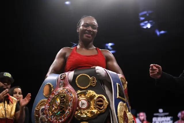 Claressa Shields poses with her belts after beating Ema Kozin