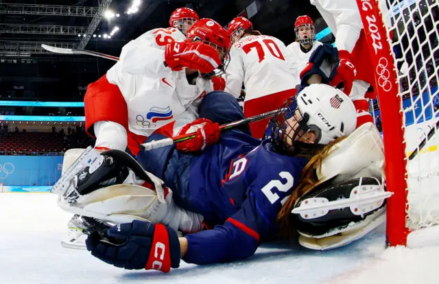 A goalmouth scramble at ice hockey at Winter Olympics