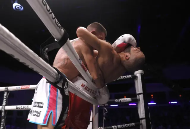 Liam Williams holds Chris Eubank Jr over the ropes