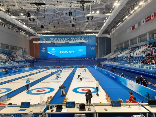 Bruce Mouat and Jen Dodds warm up on the ice