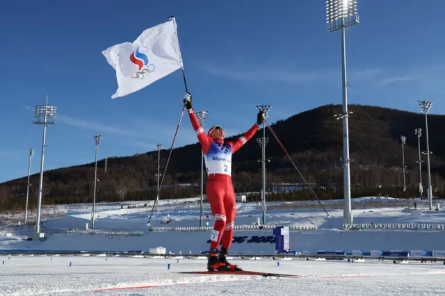 Alexander Bolshunov crossing the finish line