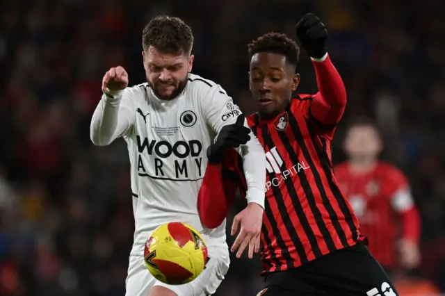 Boreham Wood's Connor Stevens and Bournemouth's Jamal Lowe