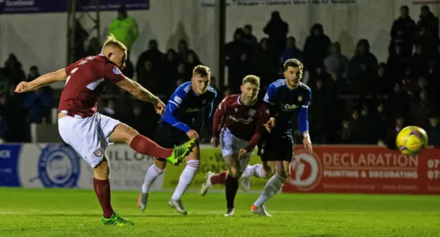 Nicky Low hammers in Arbroath's first penalty of the game