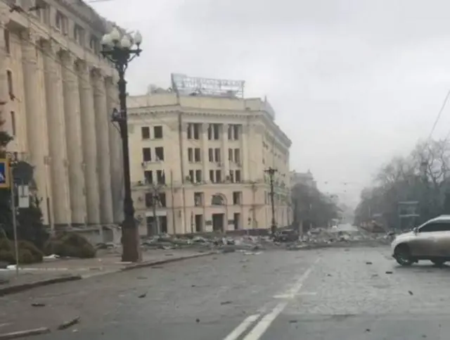 Rubble and ash outside government buildings hit in a Russian strike on 1 March