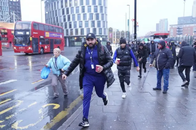 Commuters rush on foot through London