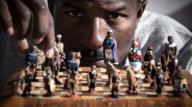 Teddy Kossoko in front of a chess board