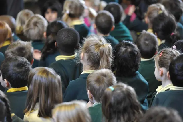 Primary school students in an assembly.