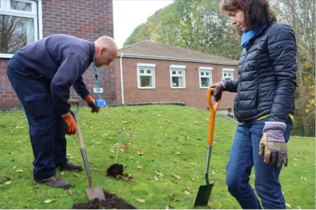 NHS workers working on the gardens