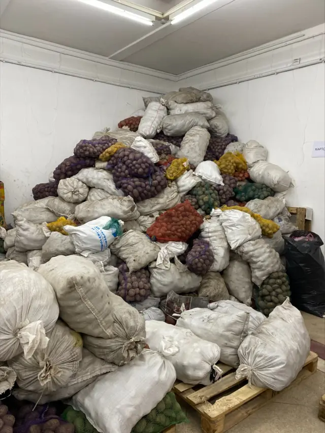 Sacks of potatoes piled high