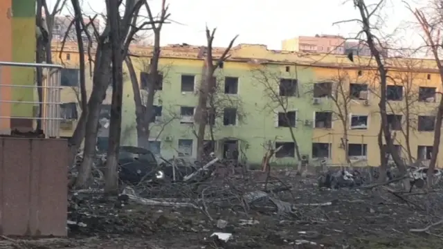 Mariupol city council showed the courtyard outside of the hospital was badly damaged