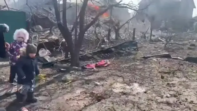 The aftermath of artillery shelling by Russia is seen on a residential area in Mariupol