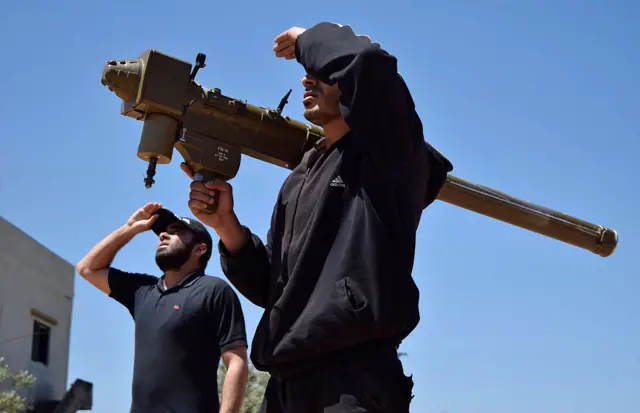 A Syrian rebel holding a surface-to-air weapon