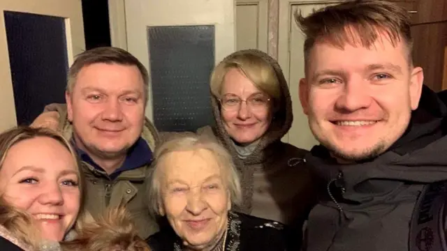 Dmytro and family after escape