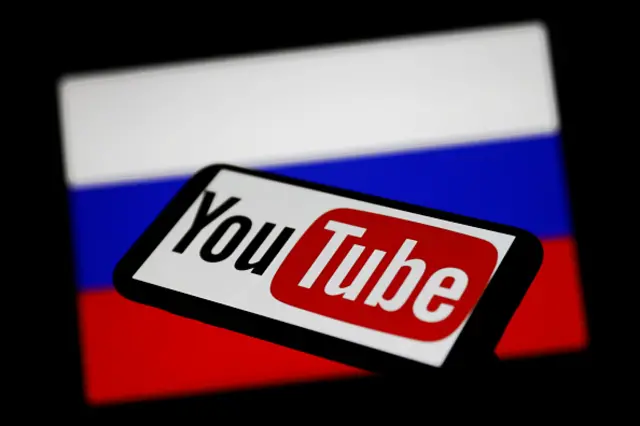 A YouTube logo beside a Russian flag