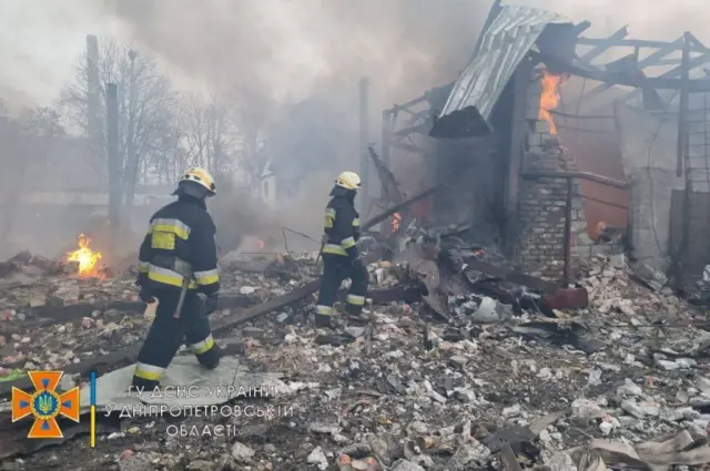 Rescuers work among remains of buildings damaged by an air strike in Dnipro, Ukraine