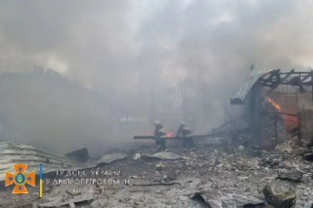 Firefighters attempting to put out the blaze from the Russian air strikes