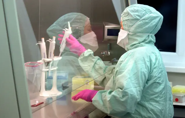 A Ukrainian healthcare worker performs Covid tests in a bacteriological laboratory in Lviv Regional in January 2021