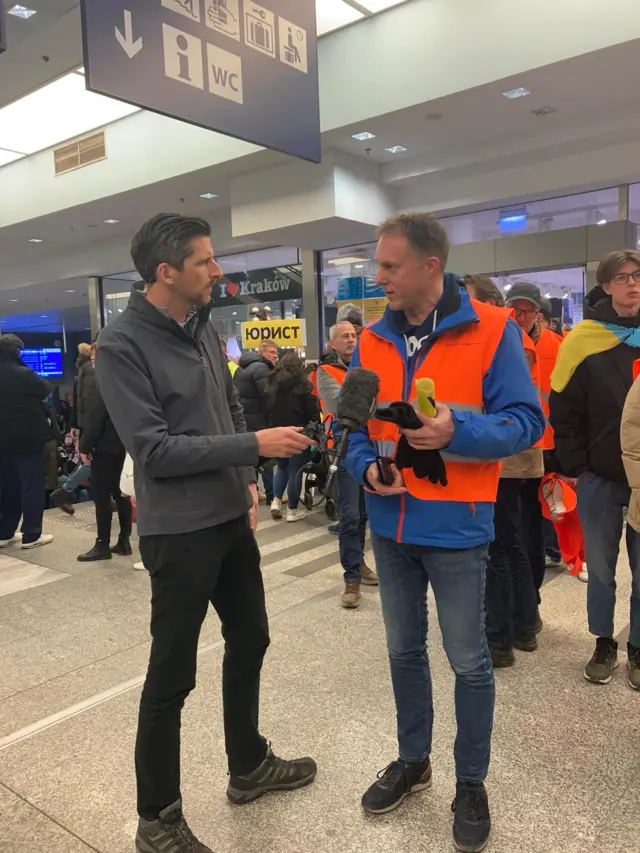 Robert at the train station with the BBC's Dan Johnson