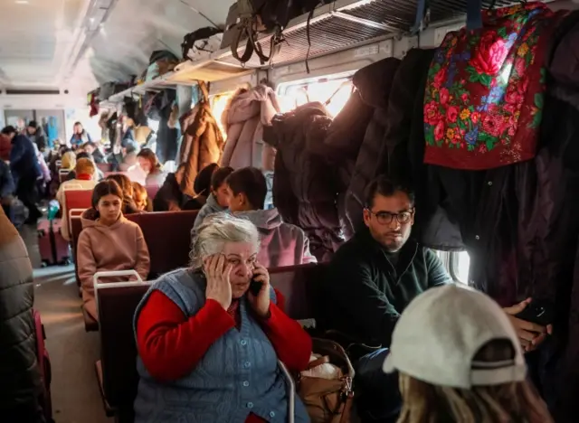 People on an evacuation train from Kyiv to Lviv