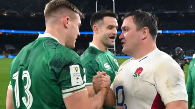 Jamie George shakes hands with Ireland's Garry Ringrose